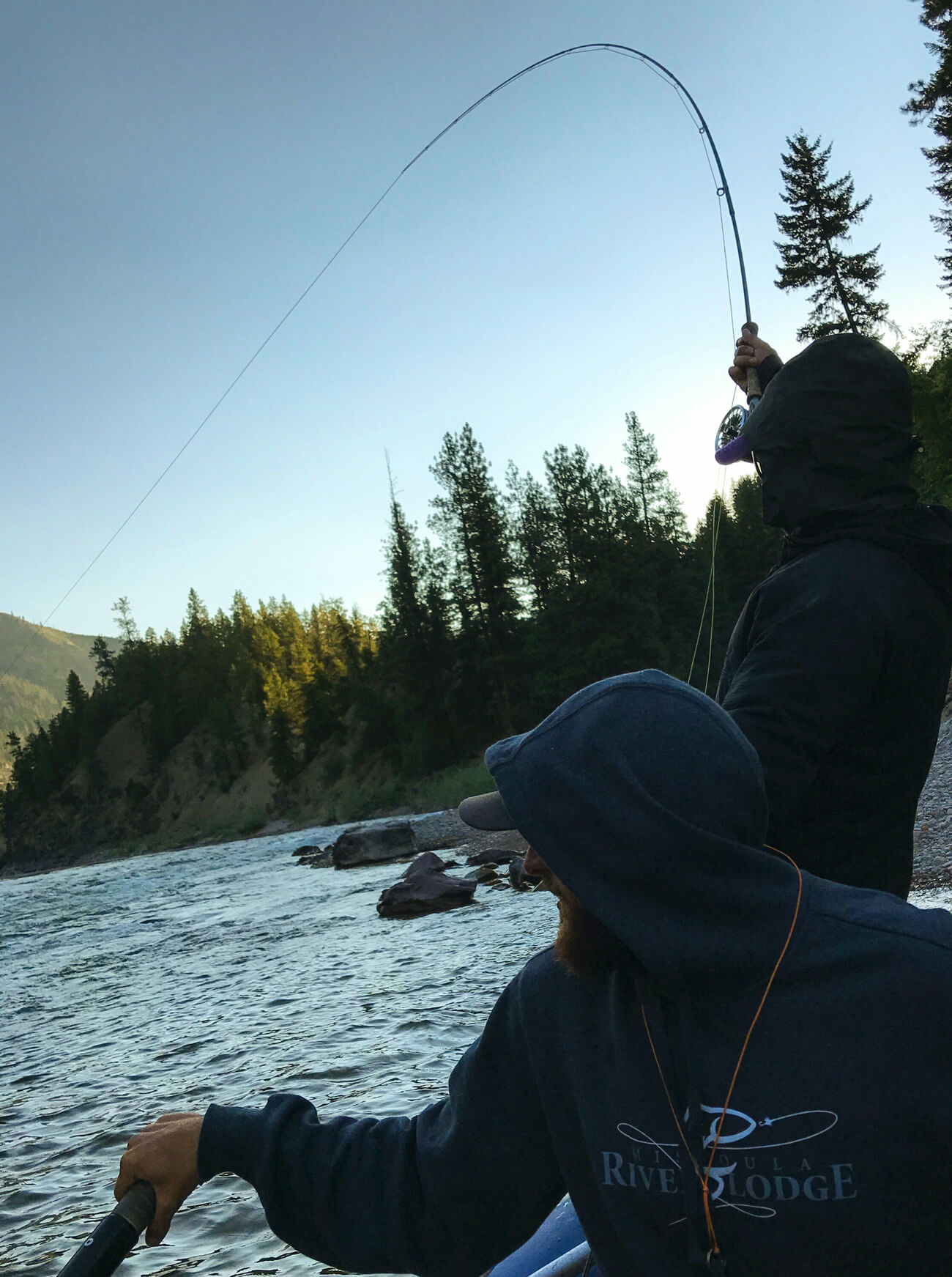 Montana Fly Fishing Angler Hooking a Trout Missoula Fly Fishing Guides Photography