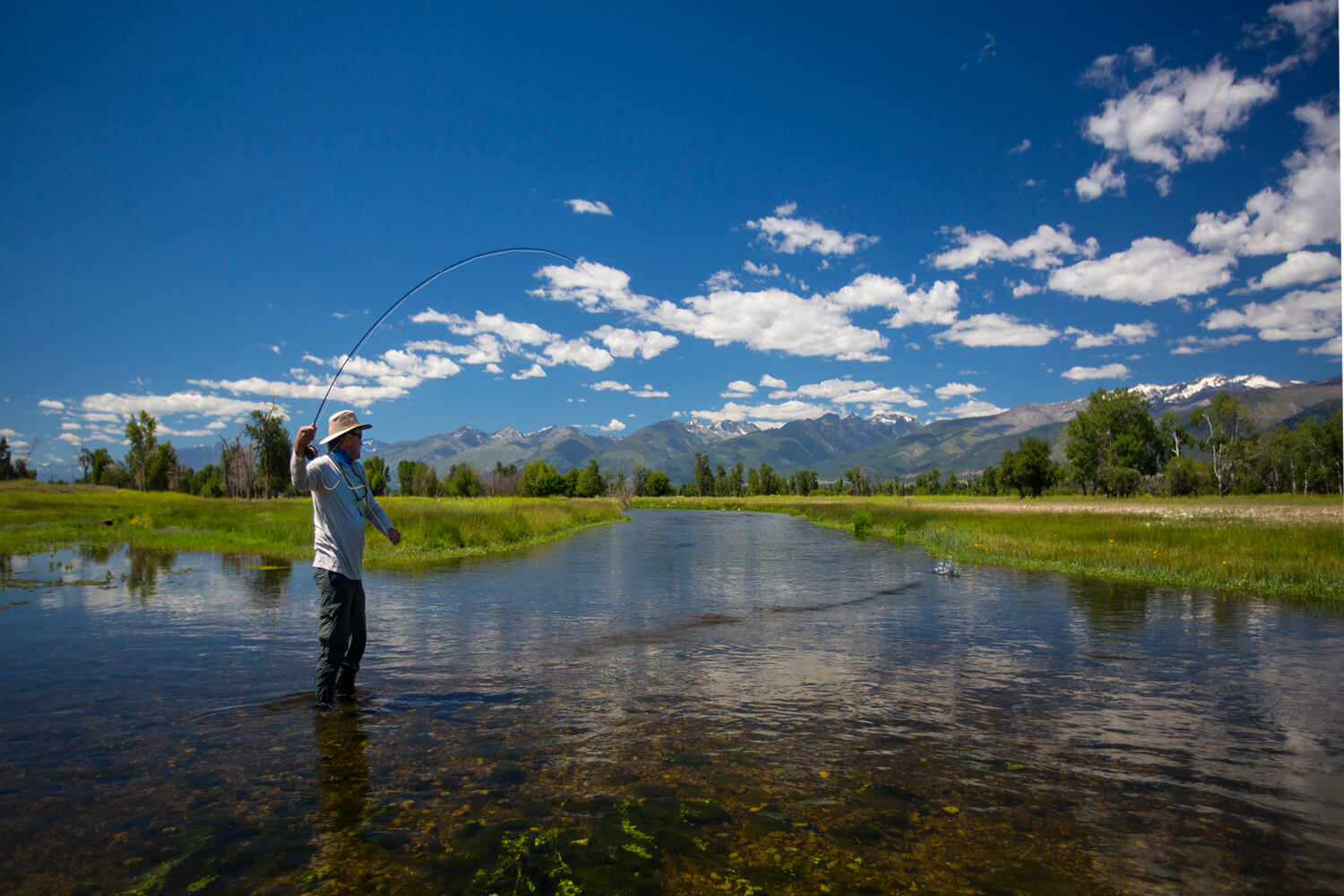 Man fly fishing in Montana river.
