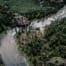 Aerial view of river bend and forest.