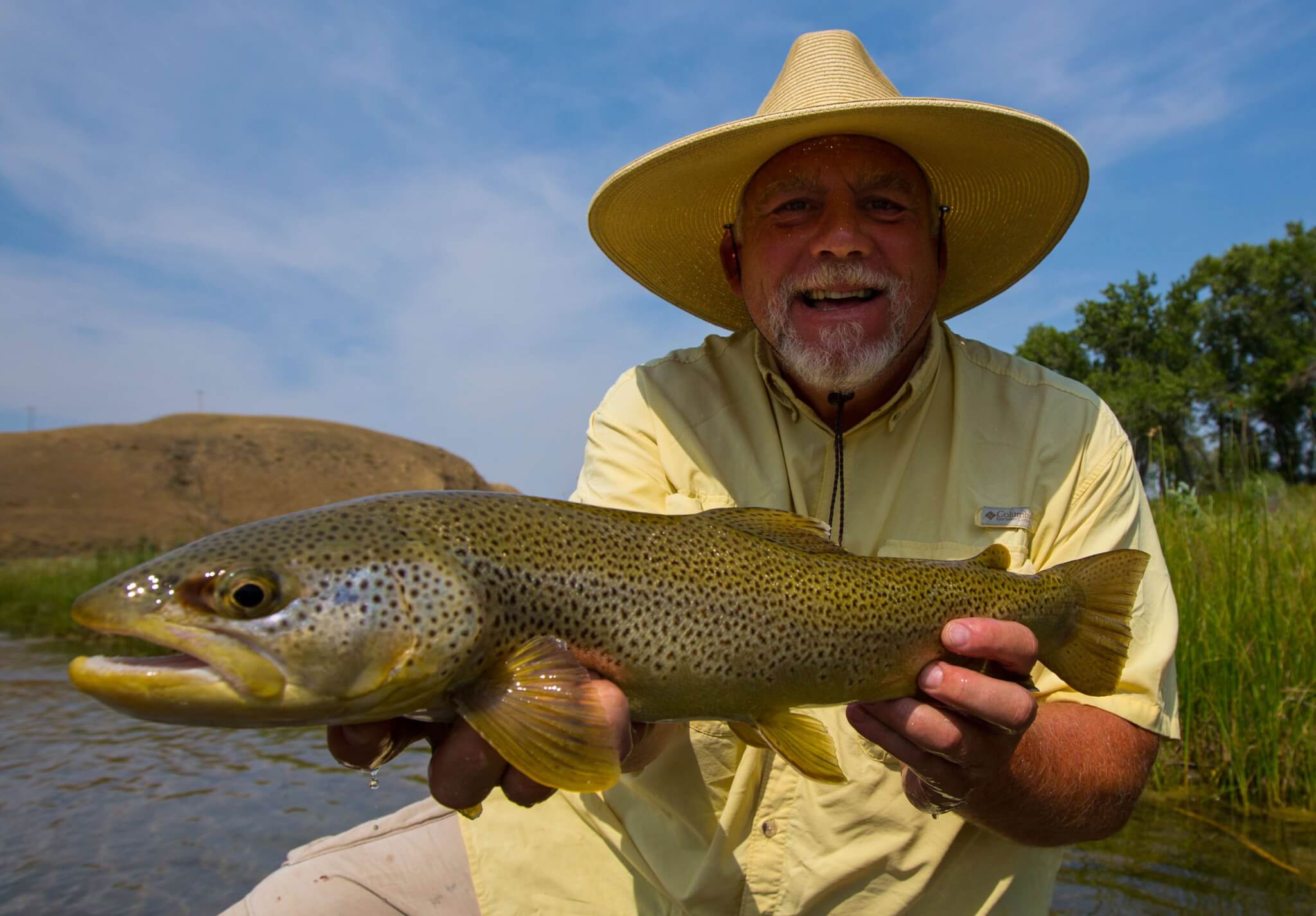 Person holding fish.