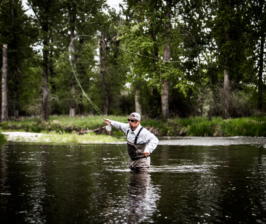 bittcraigbr4 Person fly fishing in river.