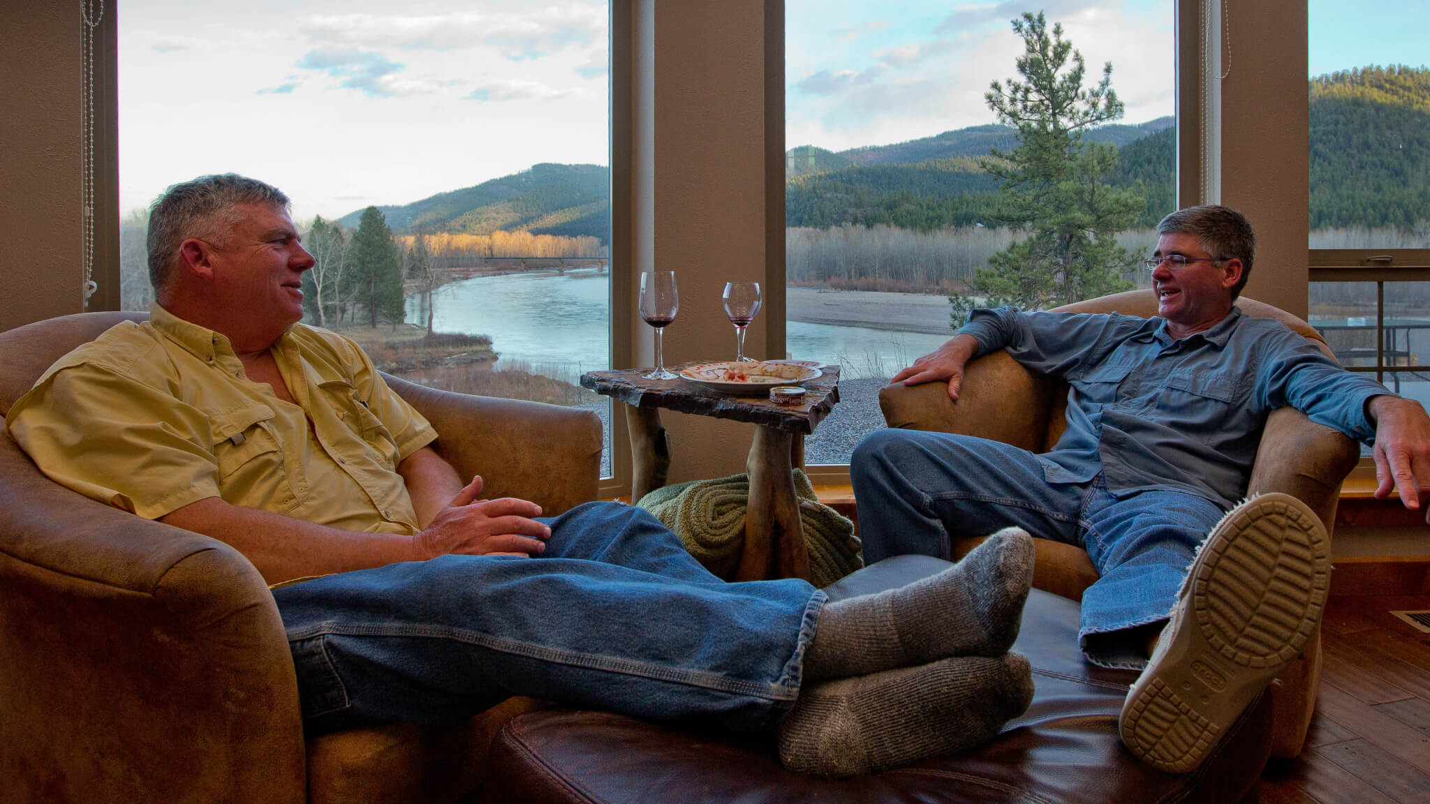 Two people lounging in lodge.